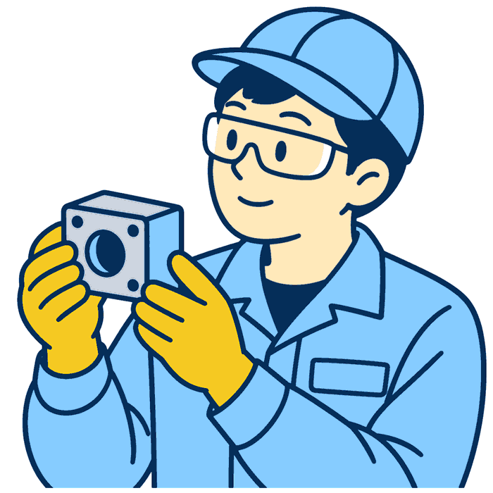 作業着姿の人が完成した部品を手に取って確認しているイラスト